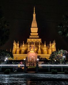 a large golden building lit up at night