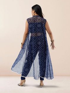 Step out in style with our Vibrant Verve Blue Bandhani Chiffon three Piece Suit. This elegant Indo Western ensemble features a beautiful blue Bandhani design on flowing chiffon fabric, exuding a perfect blend of traditional and contemporary charm. The three-piece suit includes a top, bottom, and dupatta, offering versatility and sophistication for various occasions. Care Instructions: Dry clean recommended to maintain the fabric's quality and colors. Sleeveless Georgette Dress For Eid, Bollywood Style Chiffon Dress With Sheer Dupatta, Blue Georgette Maxi Length Set, Blue Georgette Chiffon Maxi Dress, Blue Georgette Dress With Traditional Drape, Bollywood Style Chiffon Saree Dress, Sheer Georgette Dress For Eid, Festive Sheer Georgette Dresses, Bollywood Chiffon Saree Dress