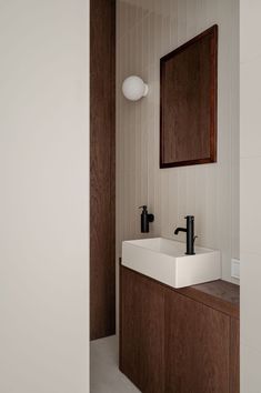 a bathroom with two sinks and a mirror