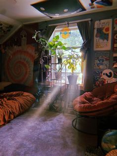 a room with a bed, chair and plants in it