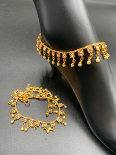 Antique look anklets with pearls and square type Kundans Handmade jewelry One gram gold jewelry Silver-plated jewelry Official Website globusfashions.com 🌸 S H O P . M O R E . S T Y L E S 🌸 https://www.etsy.com/shop/Globusfashions Necklaces - https://www.etsy.com/shop/Globusfashions?section_id=18712263 Bracelets - https://www.etsy.com/shop/Globusfashions?section_id=18969767 Pendant Sets - https://www.etsy.com/shop/Globusfashions?section_id=18707402 Tikka - https://www.etsy.com/shop/Globusfashi Festive Kundan Gold Anklets, Festive Gold Kundan Anklets, Adjustable Gold Anklets With Latkans, Gold Bollywood Anklets For Festive Season, Bollywood Style Gold Anklets With Latkans, Gold Anklets For Wedding And Diwali, Festive Gold Bollywood Anklets, Festive Gold Toe Ring Anklets, Gold Anklets For Diwali Gift