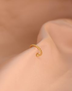 Take your earring stack to the next level, whether or not you have a piercing! The Blair cuff doesn't require a hole, but looks like a the real deal. Wear it alone, or with other earrings if you have piercings! -24K Gold Filled cuff -Sold individually (not as a pair) Dainty Adjustable Ear Cuff For Pierced Ears, Trendy Yellow Gold Single Cartilage Earring, Trendy Yellow Gold Cartilage Earring, Everyday Single Ear Cuff With Open Ring, Gold Open Ring Ear Cuff Single Earring, Minimalist Clip-on Cartilage Earrings As Gift, Minimalist Clip-on Cartilage Earrings For Gift, Everyday Single Open Ring Earring, Trendy Internally Threaded Ear Cuff As Gift