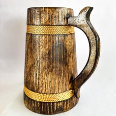 a wooden mug with rope wrapped around it