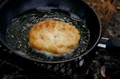 a frying pan with some food cooking on it