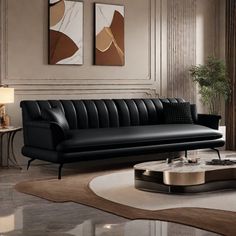 a modern living room with black leather furniture