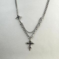 Unleash your edgy and stylish side with our Cross Pendant Necklace. Perfect for men and women, this streetwear piece adds a touch of punk and hip hop to any outfit. Stand out from the crowd and make a statement with this unisex necklace. Necklace length 19.0 inch with 2.0 inch extension chain, Chain width 4 mm. Punk Style Necklace With Adjustable Chain For Streetwear, Streetwear Jewelry With Cross Pendant Chain, Silver Cross Necklace For Streetwear, Stainless Steel Cross Necklace For Streetwear, Streetwear Jewelry: Cross Pendant Chain, Hip Hop Style, Women Streetwear, Unisex Necklace, Men Jewelry