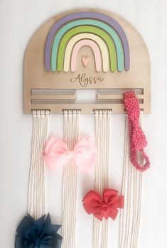 "This cute personalized custom rainbow headband and bow clip holder makes a great addition to a girl's room. They also make a great gift for baby showers and birthdays. This bow holder size is 11.5\" x 25\" approximately. The main semicircle piece is made of 1/4 birch ply; it comes with natural macrame strings where you can clip the hair bows. The rainbow is made of 1/8 MDF and hand painted by me! The name is laser engraved for precision. Hardware is not included. It can be hung on the wall usin Bow Clip Holder, Pastel Color Rainbow, Xtool F1, Clip Organizer, Rainbow Headband, Rainbow Bow, Laser Engraved Gifts, Laser Engraved Ideas, Headband Holder