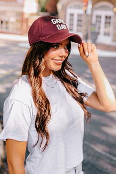 Get game day ready with this trendy baseball cap! - A rounded bill - An adjustable back - Cute sherpa 'GAME DAY' lettering on the front College Snapback Hat With Curved Visor For Baseball Season, College Baseball Cap For Baseball Season, College Snapback Dad Hat For Baseball Season, College Baseball Season Cap With Visor, Curved Visor Snapback Hat For College Baseball Season, College Baseball Season Visor Cap, Collegiate Baseball Cap With Curved Visor For Baseball Season, Collegiate Baseball Cap With Curved Visor For College, College Dad Hat For Baseball Season With Curved Visor