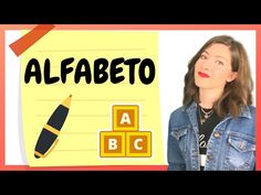 a woman standing next to a piece of paper with the word alphabet written on it