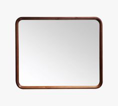 a wooden frame mirror on a white wall with a black border around the bottom half