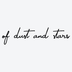 the words out of dust and stars written in black ink