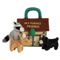 three stuffed animals in front of a bag with the words my forest friends on it