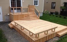 a wooden deck with steps leading up to it