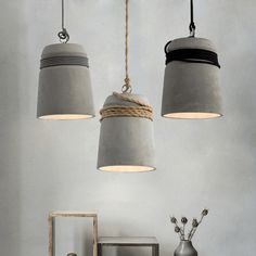 three lamps hanging from the ceiling in a room