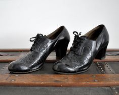 "Shoe Features: - black leather - chunky heel - lace up ties at front - perforated deco patterning on front - rounded toe Label: Krippendorf Era: 1930's Condition: Great vintage for age. Some crinkled leather on front. Some overall wear - see photos. Dimensions: Insole Length 9\" Insole Width (at widest) 2.8\" Insole Width (at heel) 1.8\" Heel 2\" Fits Like: 6/6.5 We ship worldwide. Please take time to read our shop policies." Vintage Lace-up Shoes With Low Heel And Leather Sole, Vintage Lace-up Shoes With Leather Sole And Low Heel, Vintage Low Heel Lace-up Shoes For Formal Occasions, Vintage Lace-up Shoes With Low Heel For Formal Occasions, Vintage Oxfords With Laces And Round Toe, Vintage Oxfords For Formal Occasions, Vintage Almond Toe Oxfords, Vintage Wingtip Oxfords With Laces, Vintage Formal Oxfords With Laces