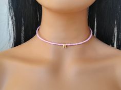 Initial beaded choker made with pink seed beads and an initial 24k gold plated letter. The choker is made with brass wire so there is no way to broken over time. The clasp is also handmade and made with hammered brass wire. Many colors available. For sizing measure your neck around the part where you want the choker to be and choose it from the menu. If you want different lenght just tell me.  The choker is adjustable. * This choker is made to order handcrafted and shipped by me, so may take 3 - 5 working days before shipping ** I ship all orders worldwide with Registered mail and Track number with Hellenic post. Your signature is require for delivery   All my jewels come to lovely gift package with Jewel's card ready for gift or gift for yourself  Buy as many jewels as you want and pay sh Handmade Pink Choker, Cheap Letter Beads Choker As Gift, Cheap Adjustable Letter Beads Choker, Unique Handmade Earrings, Beautiful Chokers, Boho Choker, Cute Necklace, Cool Necklaces, Initial Letter