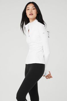 Fitted and ready for making moves. The Alosoft ½ Zip Rapid Pullover, made from velvety soft & breathable Alosoft, features invisible side zip pockets and elevated seams that contour the body for a perfect fit. Take it to the pavement with Alo performance leggings. ½ Zip, ultra-contouring pullover Velvety, breathable Alosoft Designed & uniquely fit to flatter every size Wear-tested by our in-house team for the perfect fit White Long Sleeve Alo Yoga Top, Alo Yoga White Long Sleeve Tops, Versatile Stretch Half-zip Tops, Alo Yoga Fitted Long Sleeve Activewear, Alo Yoga Long Sleeve Stretch Activewear, Alo Yoga Stretch Long Sleeve Activewear, Alo Yoga Fitted Tops For Winter, Sporty Half-zip Activewear For Layering, Functional Funnel Neck Stretch Top