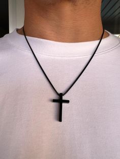 Men's Cross Pendant Necklace is a durable black-colored box chain made of hypoallergenic stainless steel. A great choice as a gift for him. Dimensions: Cross - height 30 mm, width 18 mm, thickness 4.8 mm; Chain - thickness 2 mm, length of your choice. To choose the length of the necklace: 1. Prepare a thread and a ruler. 2. Take a thread of the desired necklace length. 3. Try it on in front of a mirror to see how it will look on your neck. 4. Unwind the thread and measure its length with a ruler Black Cross Necklace With Box Chain, Black Metal Cross Necklace With Adjustable Chain, Mens Black Cross Necklace, Black Stainless Steel Cross Pendant Jewelry, Men’s Crucifix Necklace, Mens Cross Necklace, Best Gifts For Him, Mens Crosses, Stylish Necklace