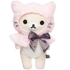 a small stuffed animal with a bow around it's neck, wearing a pink outfit