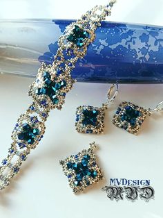 a necklace and earring set with blue crystals