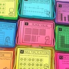 many different colored plastic boxes with numbers and fractions on them in the shape of squares