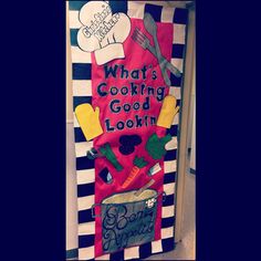 a door decorated to look like a cooking theme with the words what's cooking good looking?