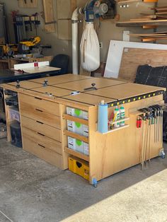 a workbench with many drawers and tools in it