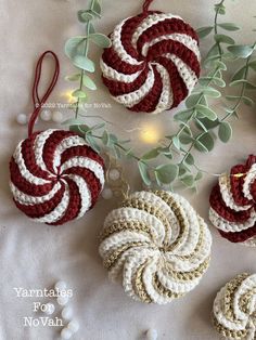 crocheted ornaments are displayed on a table