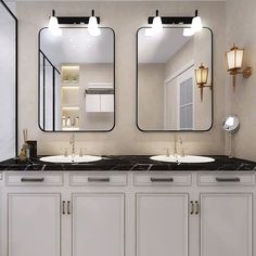 a bathroom with two sinks, mirrors and lights on the wall next to each other