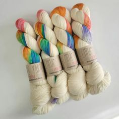 six skeins of yarn in different colors