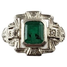 Vintage 10 Karat Yellow/White Gold Emerald and Diamond Ring Size 7 JAGi Certified- This stunning ring features one emerald cut emerald ( 7 mm x 6 mm) and eight round single cut diamonds set in beautifully detailed 10K white and yellow gold. Width: 14 mm. Shank: 2 mm. Emerald weight: 1.51 ct. Total diamond weight: .08 ct. Diamond color: H-I Diamond clarity: i1-I2 Ring Size: 7 Weight: 4.6 gr./ 2.9 dwt. Tested 10K gold. JAGi Certificate included. Very good condition, professionally polished. Will c Emerald Diamond Ring, Emerald Diamond, Emerald Cut, Diamond Clarity, 10k Gold, Cocktail Rings, Yellow White, Colored Diamonds, Emerald