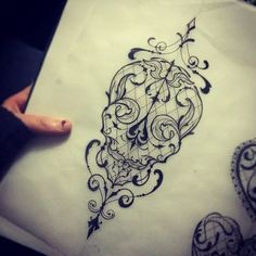 a tattoo design on paper with an arrow in the middle