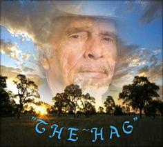 an old man with the words che hag in front of his face and trees