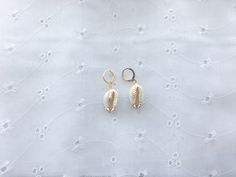 the perfect pair of huggies to wear at the beach * gold plated* lead and nickel free* real shells with a cute added touch! Costal Granddaughter Jewelry, Handmade 14k Gold Filled Earrings For Beach, Gold Small Hoop Jewelry For The Beach, Dainty Hypoallergenic Earrings For Summer, Handmade Gold Hoop Earrings For Vacation, Handmade 14k Gold Filled Jewelry For The Beach, Adjustable Gold Shell In Beachy Style, Adjustable Gold Shell With Beachy Style, Gold Shell With Beachy Style For Vacation