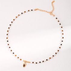 Indulge in a versatile and elegant fashion statement with our Tiger Eye Stone and Pearl Beaded Pendant Necklace. Featuring warm Melad Caramel tones and West Asian ethnic influences, this necklace perfectly blends sophistication and tradition. Make a bold fashion statement and embrace your individuality with this one-of-a-kind piece. Metal: 18ct Recycled Gold Plated Vermeil on Recycled Sterling Silver Gemstone: Freshwater Pearl/Tiger Eye Stone Pearl/Tiger Eye StoneDimensions: 3.5-4mm/3mm Length: Elegant Beaded Necklace With Gemstone Beads In Choker Style, Elegant Beaded Gemstone Choker Necklace, Elegant Gemstone Beaded Choker Necklace, Elegant Gold Pearl Necklace With Colorful Beads, Elegant Brown Beaded Necklace With Gemstone Beads, Elegant Brown Gemstone Beaded Necklaces, Elegant Brown Necklace With Polished Beads, Elegant Brown Beaded Necklace With Polished Beads, Elegant Brown Gemstone Beaded Necklace