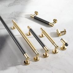 the handles and handles on this bathroom faucet are gold, silver, and black