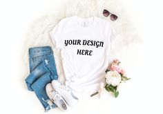 a t - shirt that says your design is here next to some flowers and sunglasses