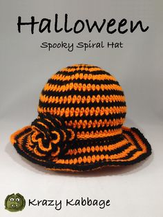 a crocheted hat with orange and black stripes