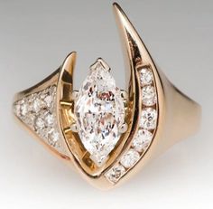 Art Deco 0.50Ct Marquise Cut Moissanite Engagement Ring Women Wedding Ring 14k Solid yellow gold Ring Anniversary Ring vintage gift For Hire 🖤 Item Information ◆ Metal:  14k Rose gold And  925 Sterling Silver ◆ Ring Size: 4 to 12 USA All Size available ◆ Main Stone  8x4mm Marquise Cut Moissanite ◆ Side Stone: 1.2 & 1.3mm Round Cut Simulated Diamond ◆ Moissanite Color: DEF Near Colorless ◆ Main Stone Creation: Lab-Created ◆ Stone Clarity: VVS1 ◆ Setting: Prong Setting ◆ Style: Halo ◆ Cut: Excell Diamond Birthstone Ring, Women Wedding Rings, Marquise Diamond Ring, Diamond Birthstone, Jewelry Wedding Rings, Antique Engagement Rings, Marquise Diamond, Delicate Rings, Brilliant Diamond