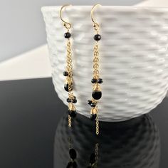 "Black Earrings, Dangle Earrings, Gold Earrings, Earrings for Women, Long Earrings, Drop Earrings, Statement Earrings, Gift for Mom Our Black Beauty Version of the Waterfall Earring. We have chosen three lengths of chain in either 14K Gold Fill or Sterling Silver and interspersed them with delicate bundles of faceted Black Spinel Rondels and a single Rondels at the top. The chains are then finished with another Rondel and a faceted Black Spinel tear drop. The effect is nothing less than stunning Dangling Beads Drop Earrings, Gift Dangle Linear Earrings With Lever Back, Gift Linear Dangle Earrings With Lever Back, Minimalist Earrings With Dangling Beads As Gift, Gift Long Drop Linear Earrings With Dangling Beads, Gift Drop Chandelier Earrings With Ear Wire, Minimalist Long Drop Earrings With Dangling Beads, Long Drop Chandelier Earrings As Gift, Minimalist Drop Earrings With Dangling Beads