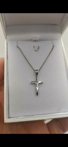 Men's Silver Cross 925. Plated for protection against tarnishing. Comes with a silver 925 plated chain. Immediately available and shipped in a gift box. An ideal cross for everyday wear that you will never part with. Choose a chain in two lengths: At 52 centimeters and at 55 centimeters Cross Dimensions: 2.5 x 1.2 x 0.2 cm. Weight (including the chain): 4g The necklase is crafted in our jewellery workshop and comes with the lifetime warranty Our jewellery made 100% in Greece Silver Cross Necklace For Father's Day Gift, Classic Silver Sterling Silver Cross Necklace, Engraved White Gold Cross Necklace As Gift, Engraved White Gold Cross Necklace Gift, Silver Crucifix Cross Necklace For Anniversary, Polished Cross Jewelry As A Gift, Father's Day Silver Cross Pendant Necklace, Silver Cross Pendant Necklace For Father's Day, Classic Silver Crucifix Jewelry