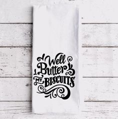 a white towel with the words well butter and biscuits printed in black ink on it