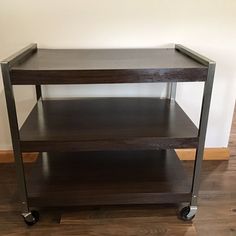 a wooden shelf sitting on top of a hard wood floor