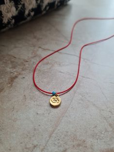 🌙 Handcrafted 14k gold plated dainty adjustable red string necklace 🌙 All materials used are tarnish free and durable 🌙 Best gift for your friends and family or just for yourself 🌙 Regular shipping takes approximately 10-15 business days depending on your country. Express shipping takes 3-5 business days. Please choose express shipping if you want to receive your package faster 🌙 I do offer combined shipping. Please feel free to contact me for custom orders and combined shipping orders 🌙 Although my products are durable and tarnish free, you better keep them away from excessive water and chemicals, perfumes etc. 🌙 For more jewelries don't forget to check my store: https://www.etsy.com/shop/MiniMoonDesign Adjustable Charm Necklaces With Tiny Beads As Gift, Adjustable Tiny Beads Charm Necklace As Gift, Gold Jewelry With Adjustable Cord For Good Luck, Adjustable Gold Charm Necklace With Tiny Beads, Spiritual Good Luck Charm Necklaces Adjustable, Dainty Handmade Adjustable Charm Necklaces, Handmade Dainty Adjustable Charm Necklaces, Handmade Adjustable Dainty Charm Necklaces, Handmade Adjustable Yellow Gold Charm Necklaces