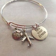 Travel bracelet. Bracelet with airplane world and stamped live your dream- Alex and Ani inspired. Bracelet is silver plated over brass. Bracelet can Travel Bracelet, Mens Chain, Necklace Mens, Alex And Ani Bracelets, Brass Bracelet, Disney Jewelry, Charm Bangle, Pandora Bracelets, Bracelet Collection