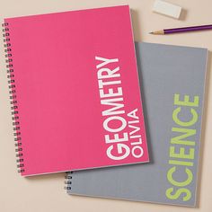 two notebooks sitting on top of each other next to a pencil and eraser