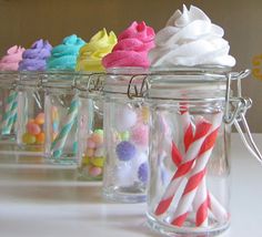 several jars filled with different types of candy