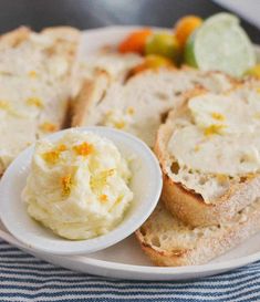 a white plate topped with slices of bread next to a bowl of mashed potatoes