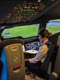 two pilots are sitting in the cockpit of an airplane