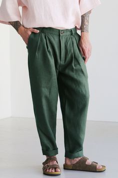 "Men's linen joggers with pleats and zip. Color on the picture - Green. Loose-fit pants are made from 100% Linen and available in a variety of colors. You can check other colors in the listing gallery. These pants are versatile, they are cozy and comfortable outdoors as well as at home. The fabric is breathable and takes the body shape, over time it becomes softer and more pleasant. Flax has a massaging effect, the fabric is antiseptic and relieves stress. Look sizes below _ _ _ _ _ _ _ _ _ _ _ Mens Linen Pants, Linen Joggers, Mens Linen, Summer Pants, Green Pants, Baggy Pant, Tapered Pants, Linen Pants, Mens Trousers